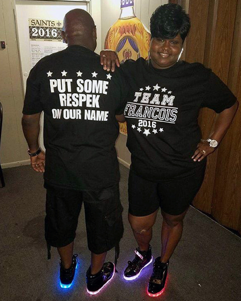 Image of a Man & Woman Wearing Custom Team Last Name T-Shirts