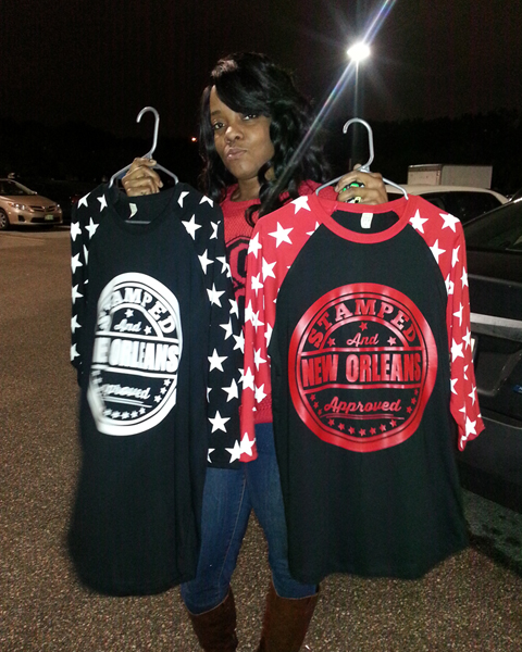 Image of a Female Holding Custom Stamped & Approved Baseball Tees